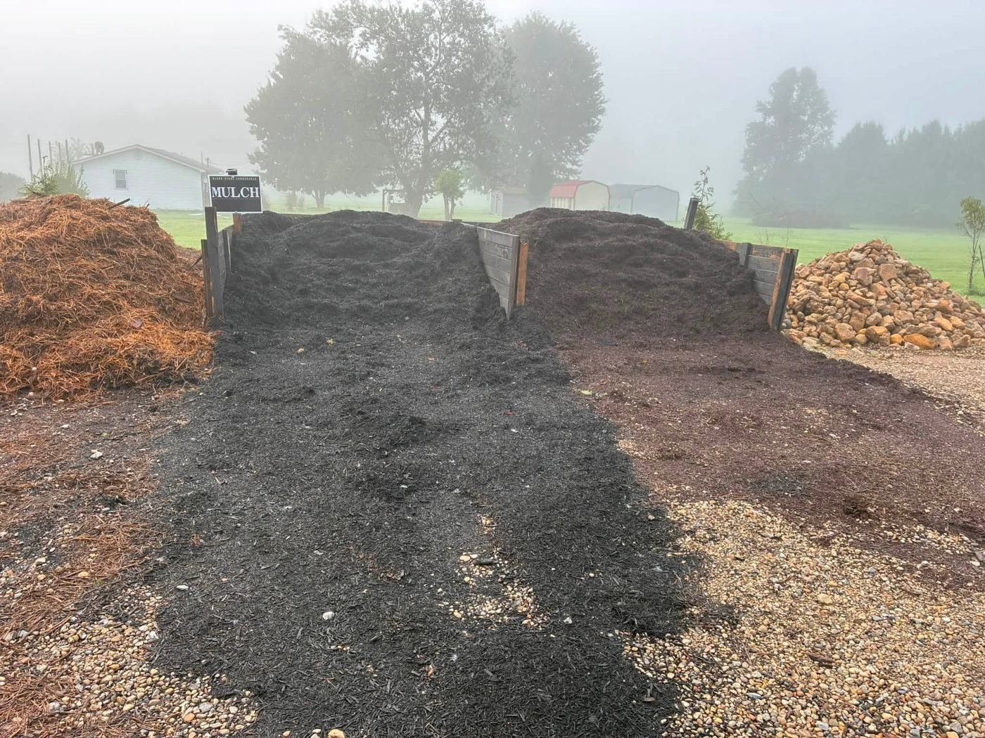 Bins of black and brown mulch at the supply yard